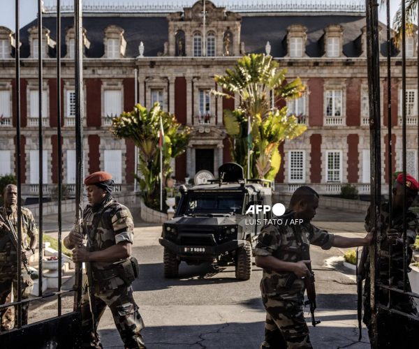 Members of the Madagascar CAPSAT military open the gates of the presidential palace in Antananarivo on October 14, 2025 before Colonel Michael Randrianirina (C), head of the CAPSAT military unit, announced that they will take power in the country. An elite Madagascar military unit told AFP on October 14, 2025 it had taken power in the country after the national assembly voted to impeach President Andry Rajoelina for desertion of duty. (Photo by Luis TATO / AFP)