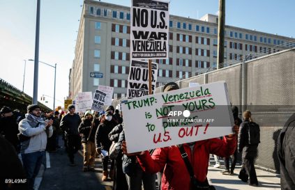 People take part in a demonstration against US military action in Venezuela outside the Metropolitan Detention Center, where ousted Venezuelan President Nicolas Maduro is being held, in the Brooklyn borough of New York City, on January 4, 2026. Venezuelan President Nicolas Maduro was in a New York jail January 3, hours after American special forces seized and flew him out of his country  which Donald Trump said would come under effective US control.
The US president's announcement followed a lightning pre-dawn attack in which commandos grabbed Maduro and his wife while air strikes pounded sites in and around Caracas. (Photo by Kena Betancur / AFP)