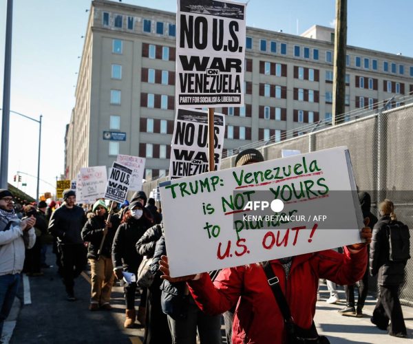 People take part in a demonstration against US military action in Venezuela outside the Metropolitan Detention Center, where ousted Venezuelan President Nicolas Maduro is being held, in the Brooklyn borough of New York City, on January 4, 2026. Venezuelan President Nicolas Maduro was in a New York jail January 3, hours after American special forces seized and flew him out of his country  which Donald Trump said would come under effective US control.
The US president's announcement followed a lightning pre-dawn attack in which commandos grabbed Maduro and his wife while air strikes pounded sites in and around Caracas. (Photo by Kena Betancur / AFP)