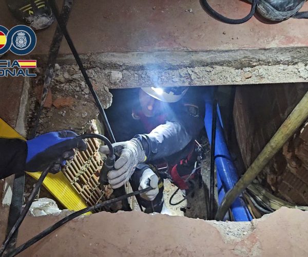 This undated handout photo released on March 31, 2026 from Spain's Policia Nacional shows the entrance to a tunnel between Morocco and Spain which police discovered in the enclave of Ceuta and which was used to smuggle tonnes of hashish. A major operation by the National Police against what investigators have dubbed the hashish network of networks has led to the discovery in Ceuta of a complex underground infrastructure designed to bring tons of drugs into Spain.  The drug tunnel, with an entrance hidden behind a large soundproofed refrigerator, had three levelsan access shaft, an intermediate chamber for storing bales, and a final line leading to Moroccoand a system of rails, wagons, pulleys, and cranes for moving pallets of hashish. (Photo by Handout / POLICIA NACIONAL / AFP) / RESTRICTED TO EDITORIAL USE - MANDATORY CREDIT "AFP PHOTO /  POLICIA NACIONAL / HANDOUT /  " - NO MARKETING NO ADVERTISING CAMPAIGNS - DISTRIBUTED AS A SERVICE TO CLIENTS