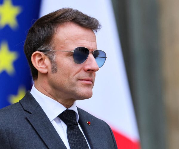 French President Emmanuel Macron wears sunglasses as he waits for the arrival of a guest at the Elysee Palace in Paris, France, January 23, 2026. REUTERS/Sarah Meyssonnier