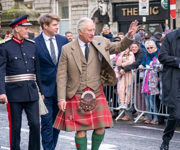 Britain's King Charles III (C) waves to members of the public during a visit to Aberdeen, on October 17, 2022. (Photo by Jane Barlow / POOL / AFP)