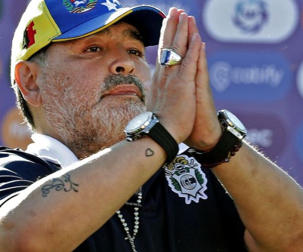 (FILES) In this file photo taken on November 02, 2019 Gimnasia y Esgrima team coach Diego Armando Maradona gestures to supporters as he leaves the field after an Argentina First Division Superliga football match against Estudiantes, at El Bosque stadium, in La Plata, Buenos Aires province, Argentina. - A lawyer for a nurse under investigation in the death of Argentine football great Diego Maradona said June 16 that doctors killed him through negligence.
"They killed Diego," attorney Rodolfo Baque told reporters after his client, nurse Dahiana Gisela Madrid, was questioned by prosecutors. (Photo by ALEJANDRO PAGNI / AFP)